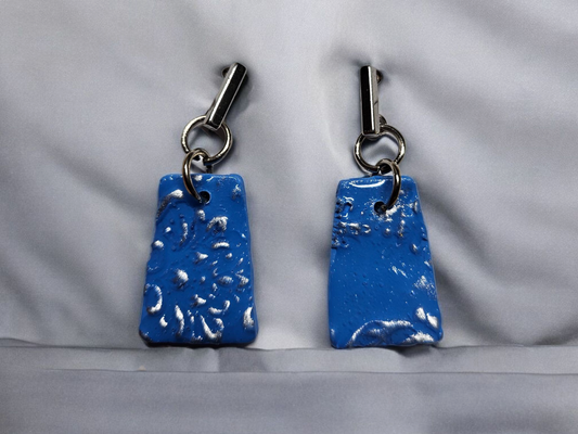 Cornflower blue earring with silver relief
